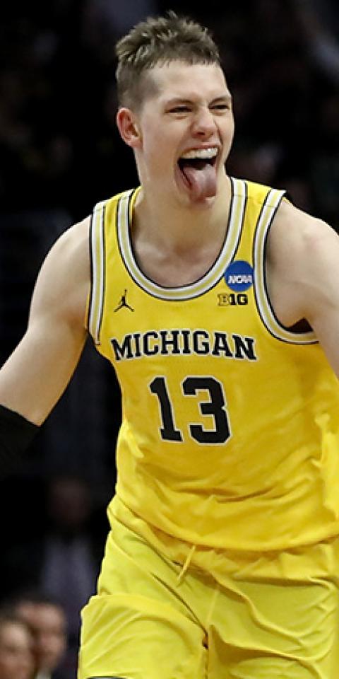 Moritz Wagner of the Michigan Wolverines celebrates after Wagner makes a three-pointer 