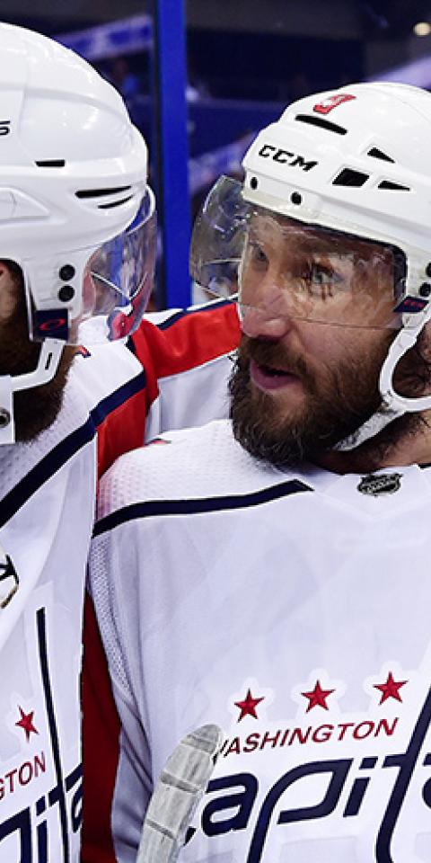 Brett Connolly #10 and Alex Ovechkin #8 of the Washington Capitals celebrate after defeating the Tampa Bay Lightning 4-0 in Game Seven of the Eastern Conference Final during the 2018 NHL Stanley Cup Playoffs at Amalie Arena on May 23, 2018 in Tampa, Florida. 