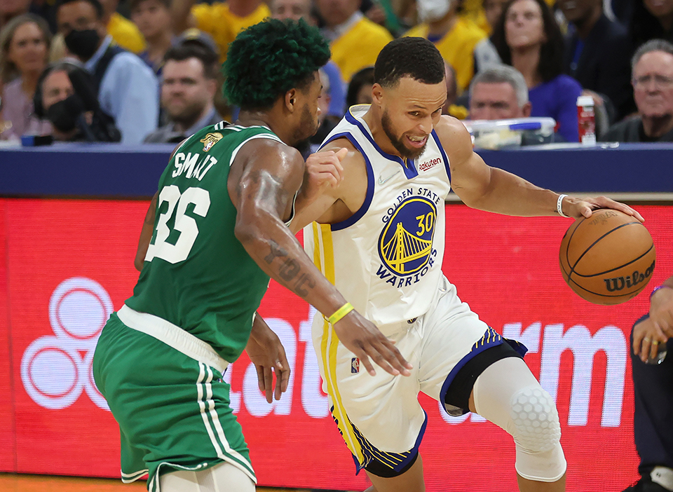 Steph Curry's (right) Warriors are favored in the Celtics vs Warriors odds.