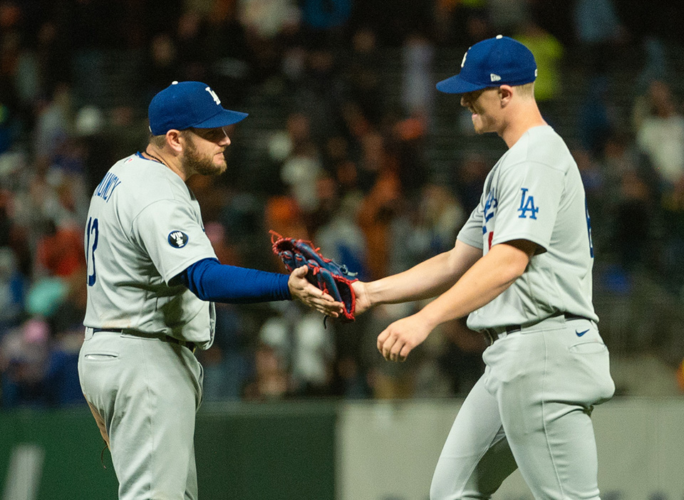 Max Muncy (left) and the Dodgers are favored in the Cardinals vs Dodgers odds