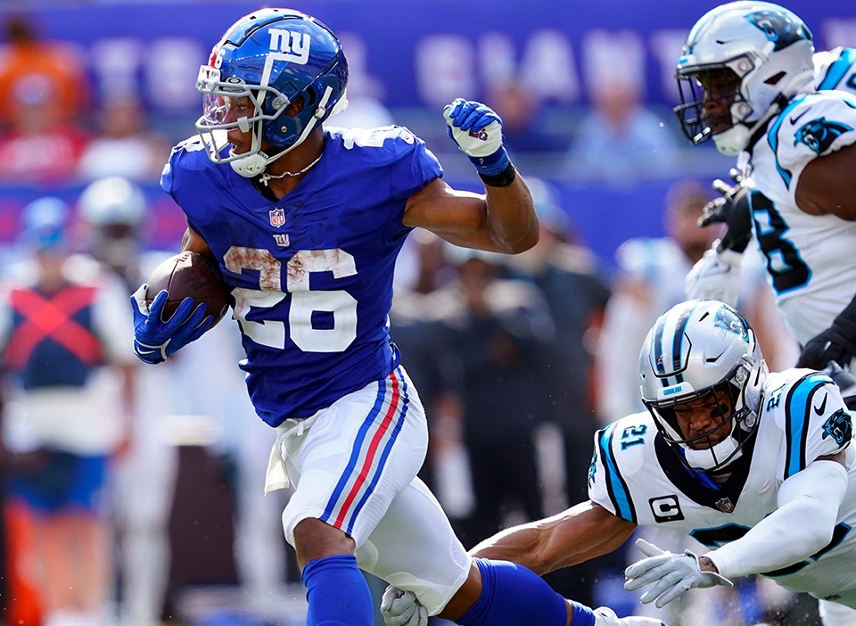 Saquon Barkley (left) and the Giants are favored in the Cowboys vs Giants odds