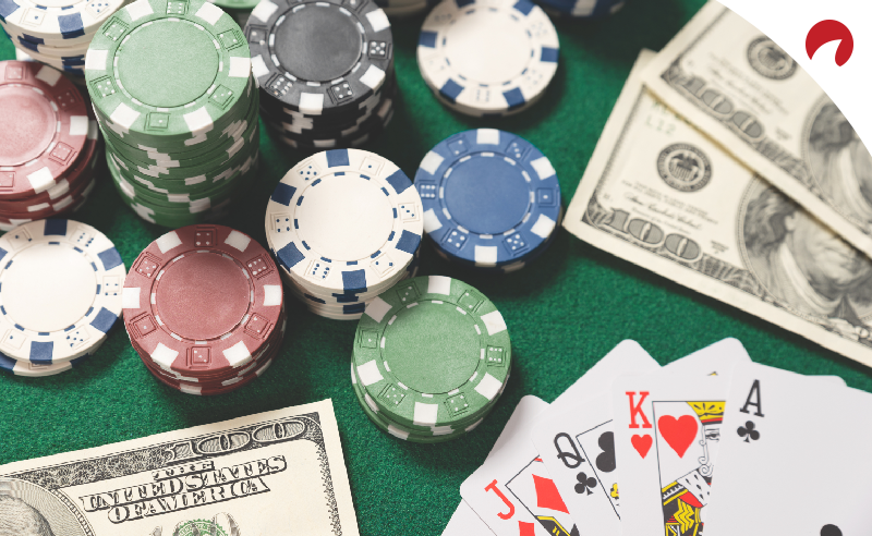 online poker banking money, chips, and cards on table