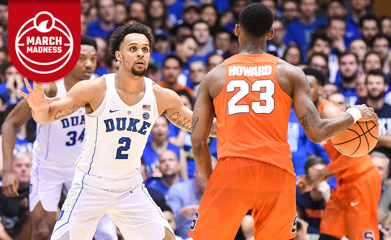 Duke Blue Devils guard Gary Trent Jr. defends Syracuse Orange guard Frank Howard at the top of the key during the men's college basketball game