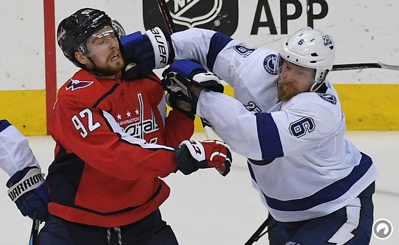 Washington Capitals center Evgeny Kuznetsov gets hit by Tampa Bay Lightning defenseman Anton Stralman