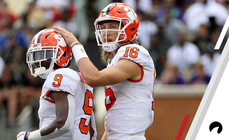 Teammates Trevor Lawrence #16 and Travis Etienne #9 of the Clemson Tigers watch on against the Wake Forest Demon Deacons during their game at BB&T Field on October 6, 2018 in Winston Salem, North Carolina.