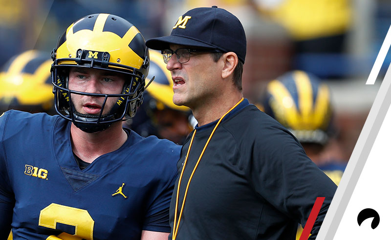 Michigan quarterback Shea Patterson (2) talks with head coach Jim Harbaugh before in the first half of an NCAA football game in Ann Arbor, Mich., Saturday, Oct. 6, 2018.