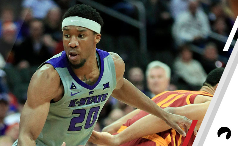 Kansas State forward Xavier Sneed (20) spins away from Iowa State guard Talen Horton-Tucker (11) during the first half of an NCAA college basketball game in the semifinals of the Big 12 Conference tournament in Kansas City, Mo., 