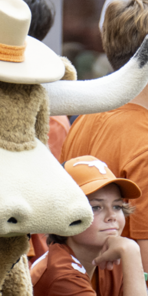 Texas Longhorns Mascot standing next fans