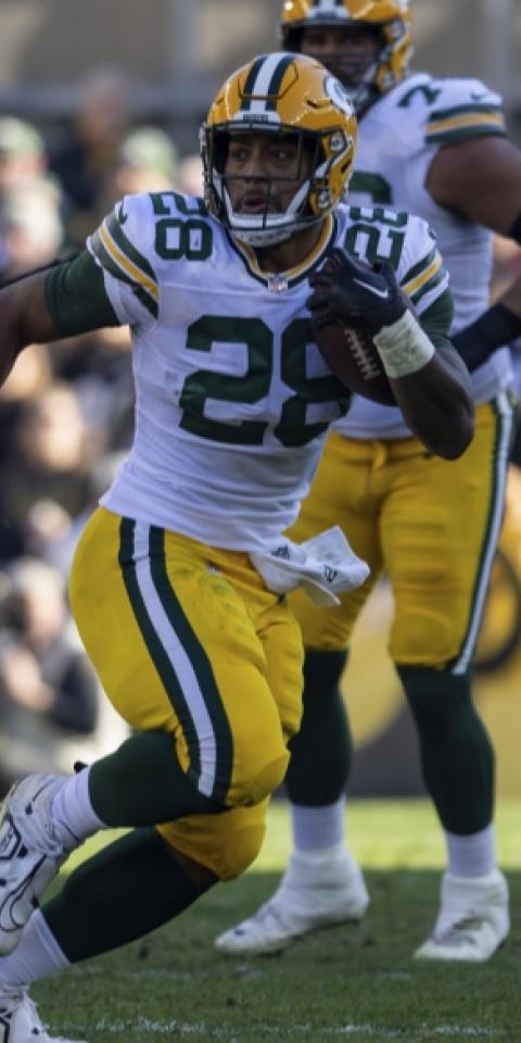 AJ Dillon's Green Bay Packers featured in our Packers vs Lions picks and odds