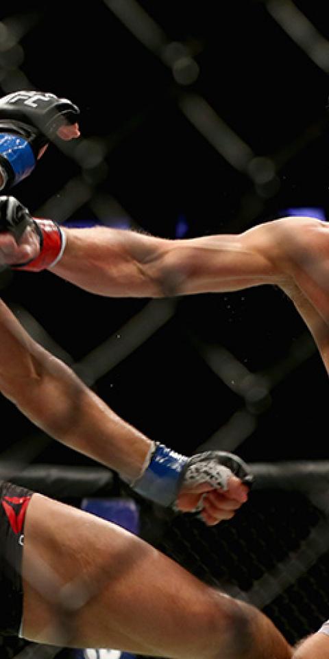 Stephen Thompson lands a punch against Jorge Masvidal in their welterweight bout during UFC 217 