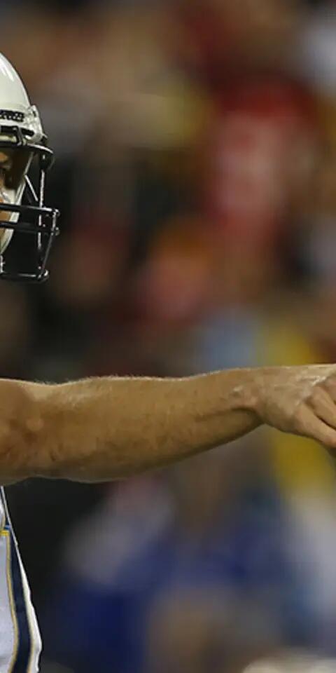 Los Angeles Chargers quarterback Philip Rivers (17) calls out the offense during the first quarter of a week 15 NFL game between the Los Angeles Chargers and Kansas City Chiefs on December 16, 2017 at Arrowhead Stadium in Kansas City, MO.