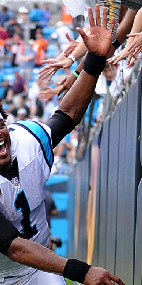 Carolina Panthers quarterback Cam Newton (1) runs down the wall to high five the fans but they weren't ready for him after the NFL game between the Cincinnati Bengals and the Carolina Panthers on September 23 2018, at Bank of America Stadium in Charlotte,NC.