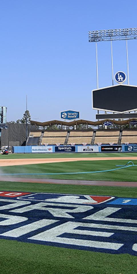 Grounds crew prepare the field for World Series game three betweeen the Boston Red Sox and the Los Angeles Dodgers at Dodger Stadium on October 25, 2018 in Los Angeles, California.