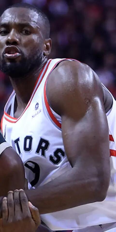 Khris Middleton #22 of the Milwaukee Bucks dribbles the ball as Serge Ibaka #9 of the Toronto Raptors defends during an NBA game at Scotiabank Arena on December 9, 2018 in Toronto, Canada