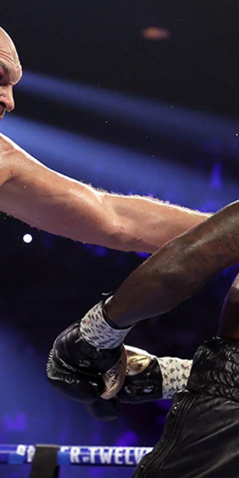 Tyson Fury (right) is favored in the Fury vs Wilder 3 odds.