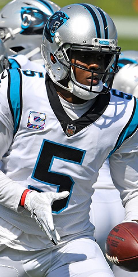 Teddy Bridgewater (5) of the Carolina Panthers hands off against the Arizona Cardinals during their NFL game at Bank of America Stadium on October 4, 2020, in Charlotte, North Carolina.
