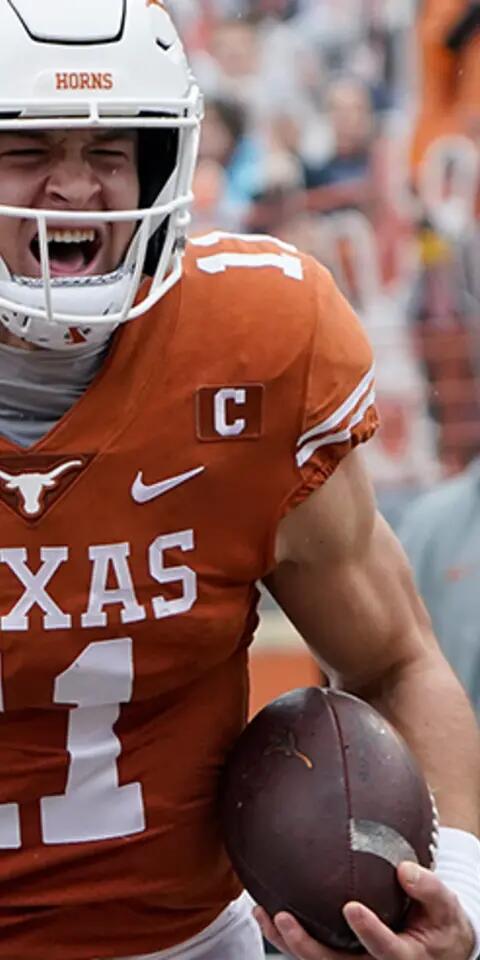 Texas quarterback Sam Ehlinger (11) reacts as he scores a touchdown against Iowa State during an NCAA college football game on Nov. 27, 2020, in Austin, Texas.