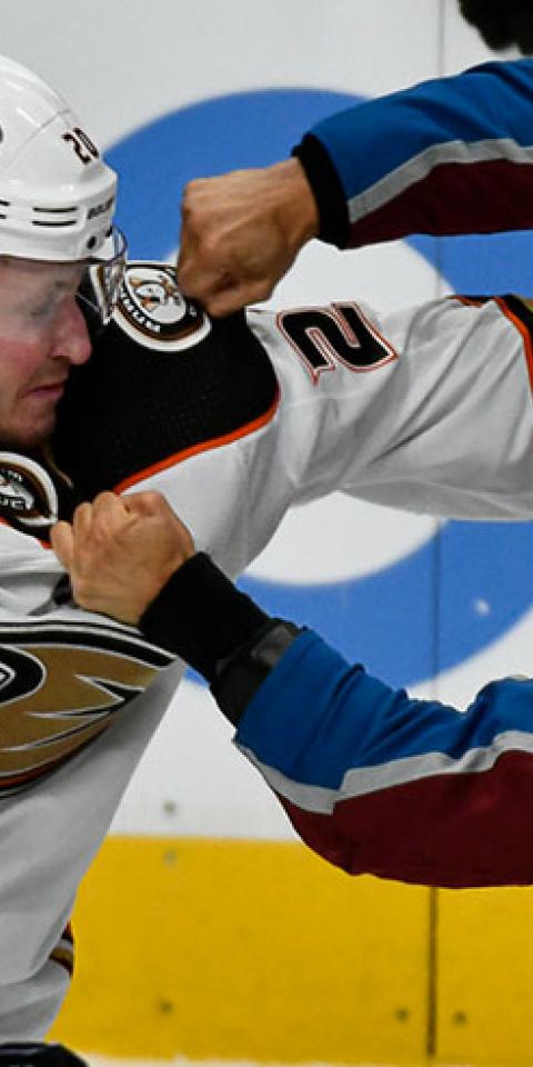 Anaheim Ducks left wing Nicolas Deslauriers (20) and Colorado Avalanche center Pierre-Edouard Bellemare (41) exchange blows during the first period in an NHL hockey game.