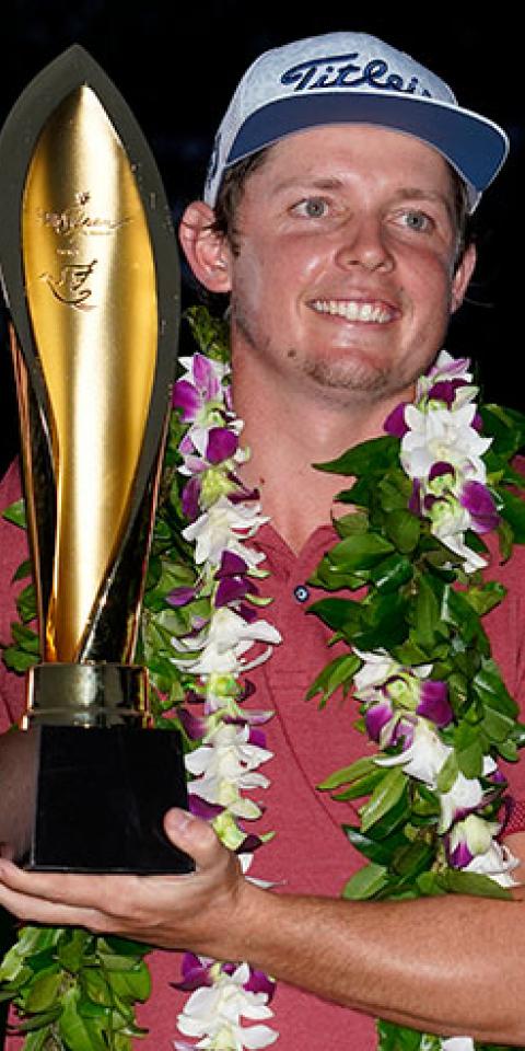 Cameron Smith poses with a trophy after winning the 2020 Sony Open.