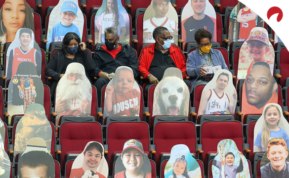 Fans sit between cardboard cutouts before the Minnesota Timberwolves and the Houston Rockets in April, 2021.